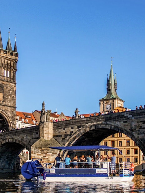 Boat tour on Vltava River near Charles Bridge, Prague.