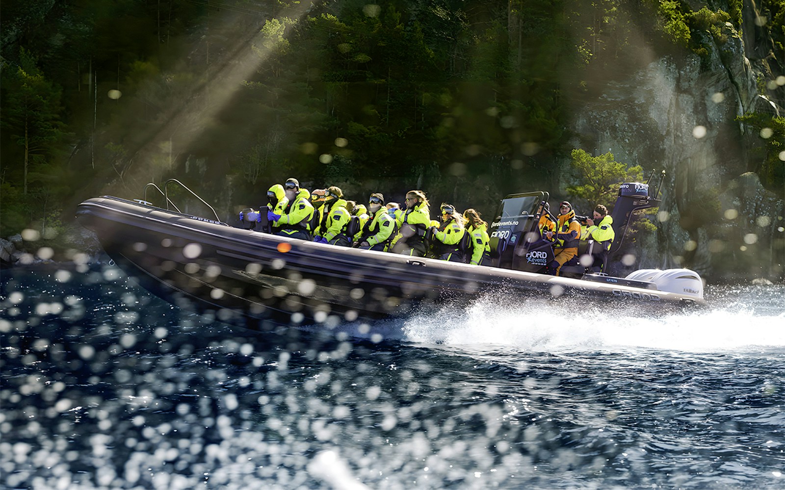 RIB boat on Lysefjord Safari with guide and guests exploring Norwegian fjord scenery.