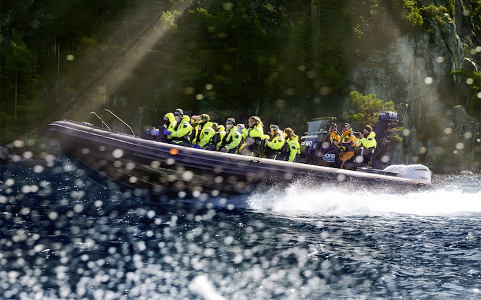 Guests on RIB boat during Lysefjord Safari with guide, Norway.
