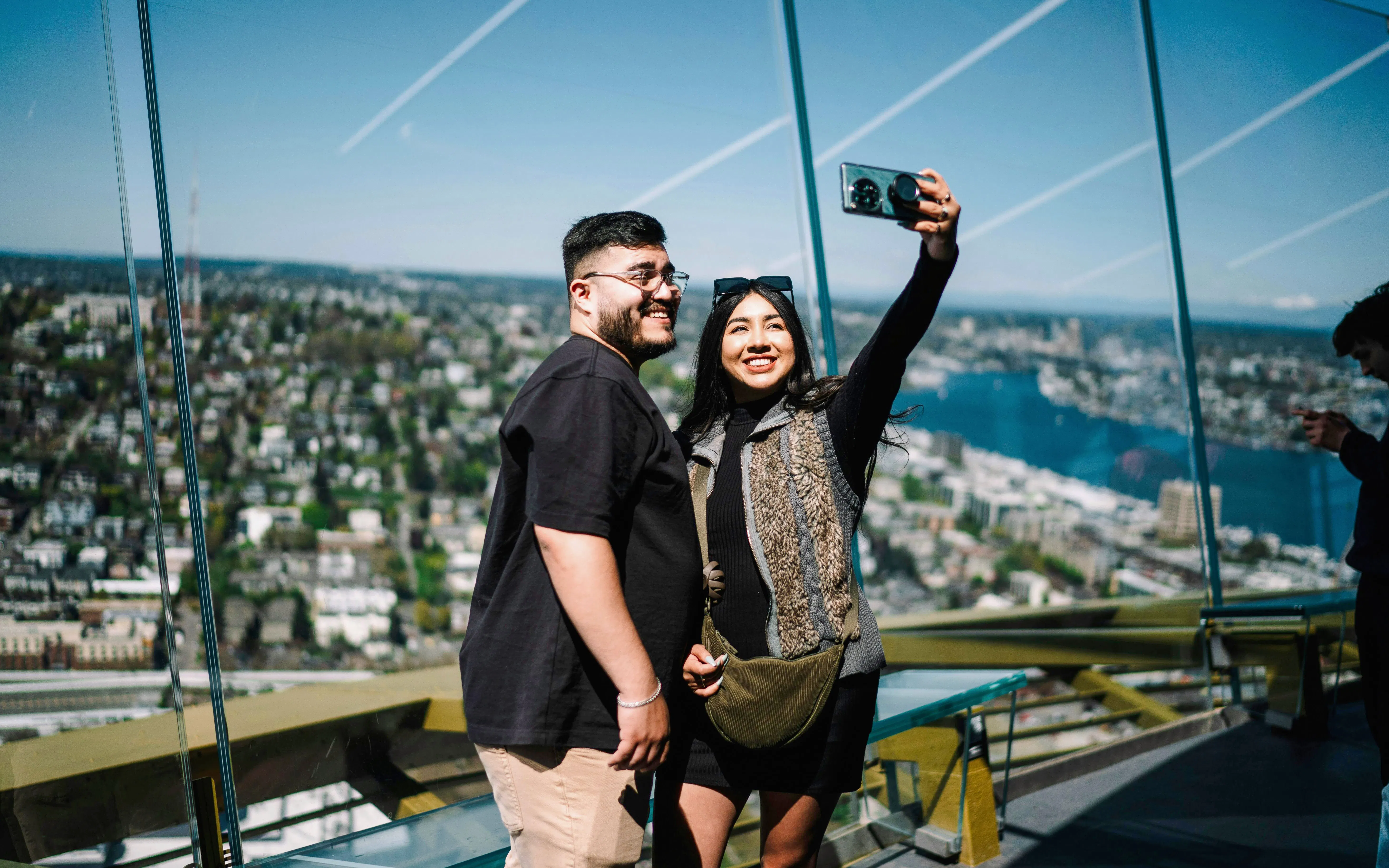 Visitors taking a selfie at the Space Needle observation deck, Seattle.
