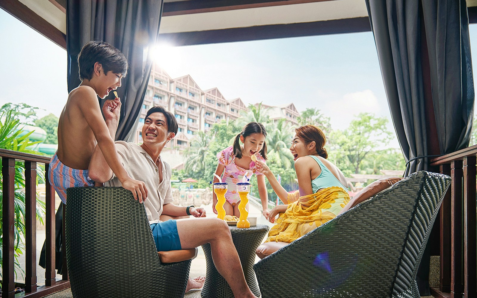 Guests enjoying drinks and snacks at Adventure Cove Waterpark™ cabana.