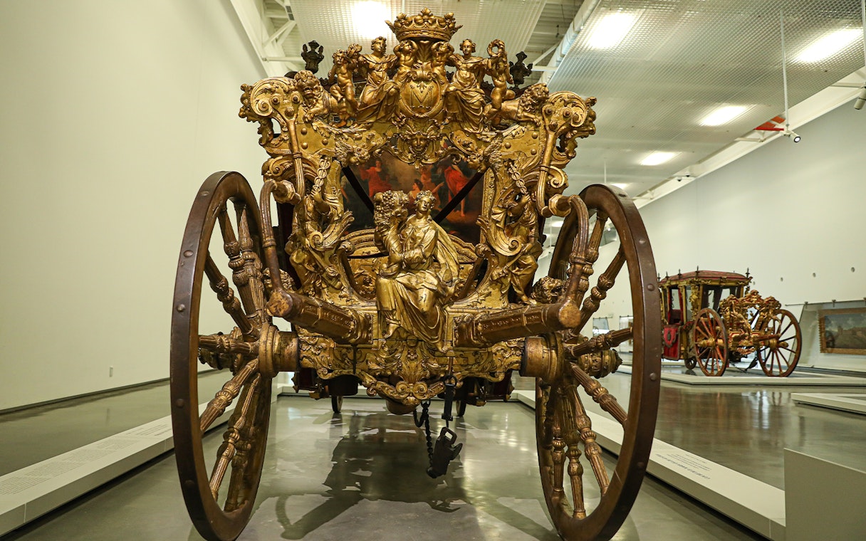 Ornate golden carriage at the National Coach Museum, Lisbon.