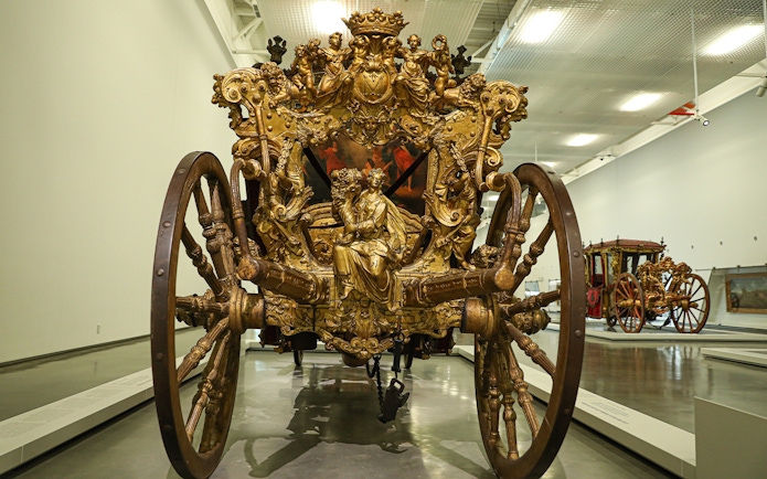 Ornate golden carriage at the National Coach Museum, Lisbon.