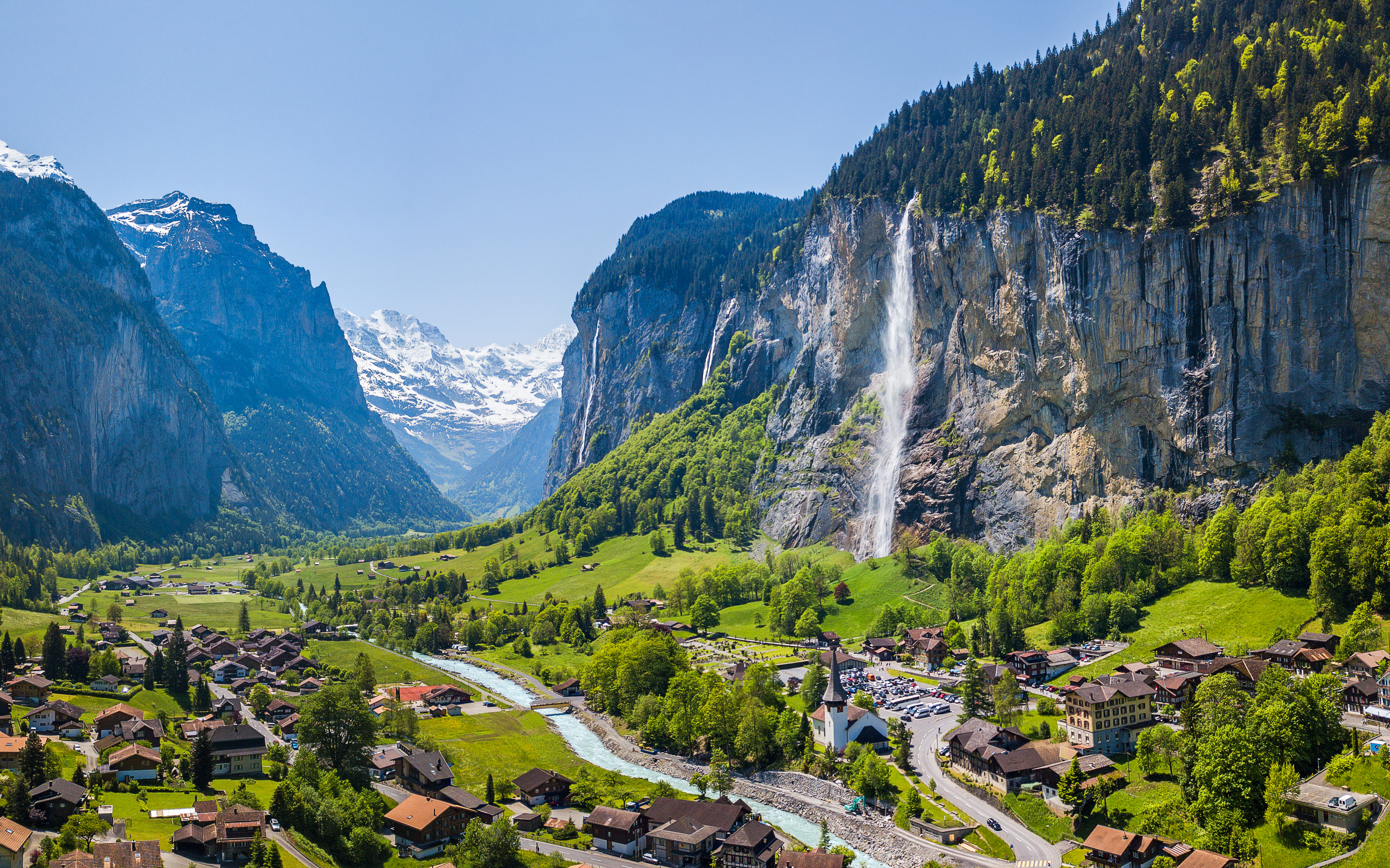 Lauterbrunnen village with Staubbach waterfall and Jungfrau mountain in the background.