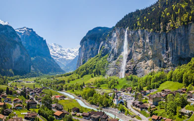 Lauterbrunnen village with Staubbach waterfall and Jungfrau mountain in the background.