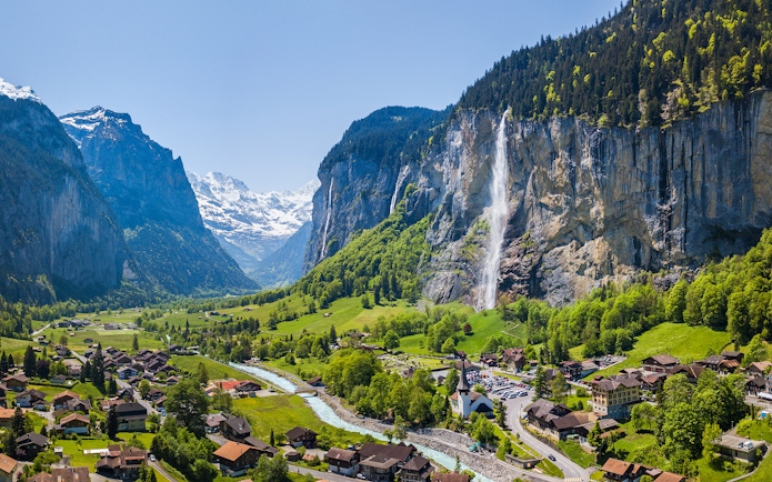 Lauterbrunnen village with Staubbach waterfall and Jungfrau mountain in the background.