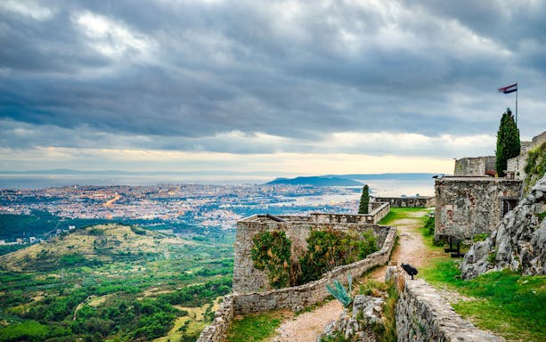 Fortress of Klis overlooking Split at sunset, Croatia.