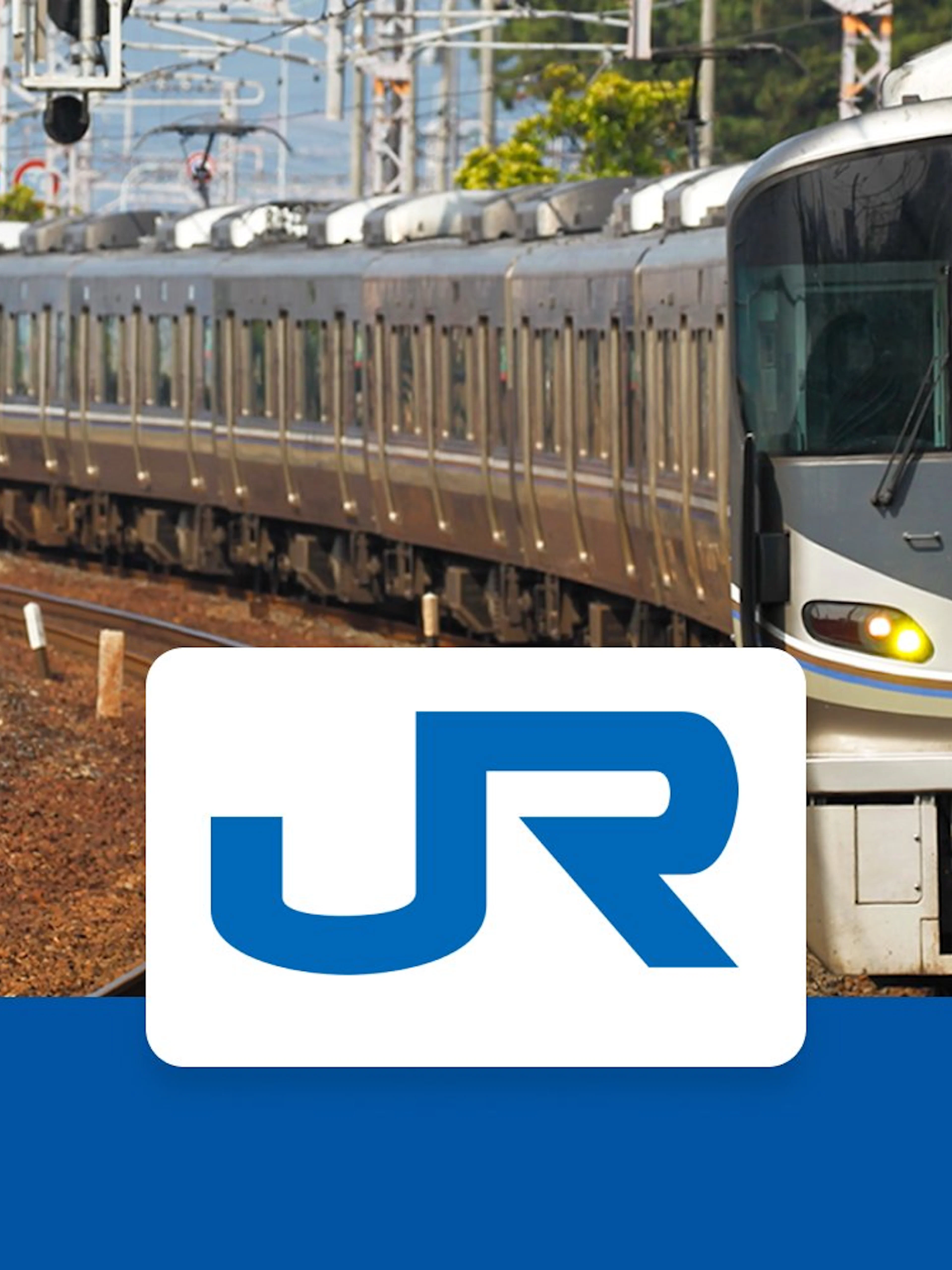 JR train on tracks in Kansai region, Japan, with JR logo in foreground.