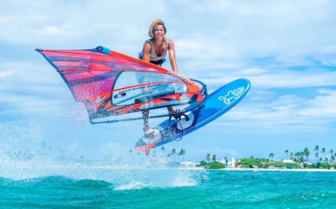 Windsurfer catching air over waves in Delta Neretva, Croatia.