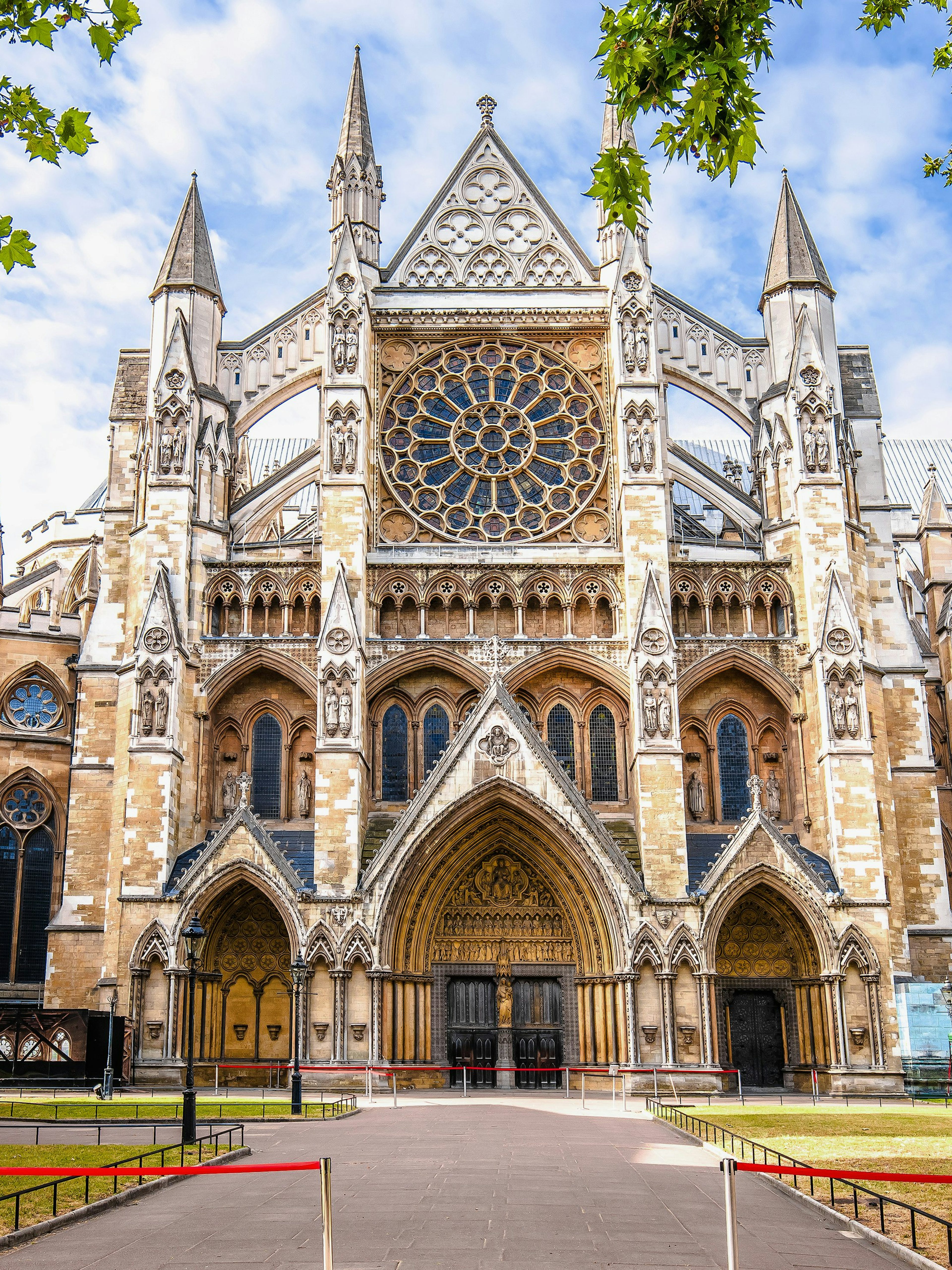 Westminster Abbey exterior with Gothic architecture and rose window in London.