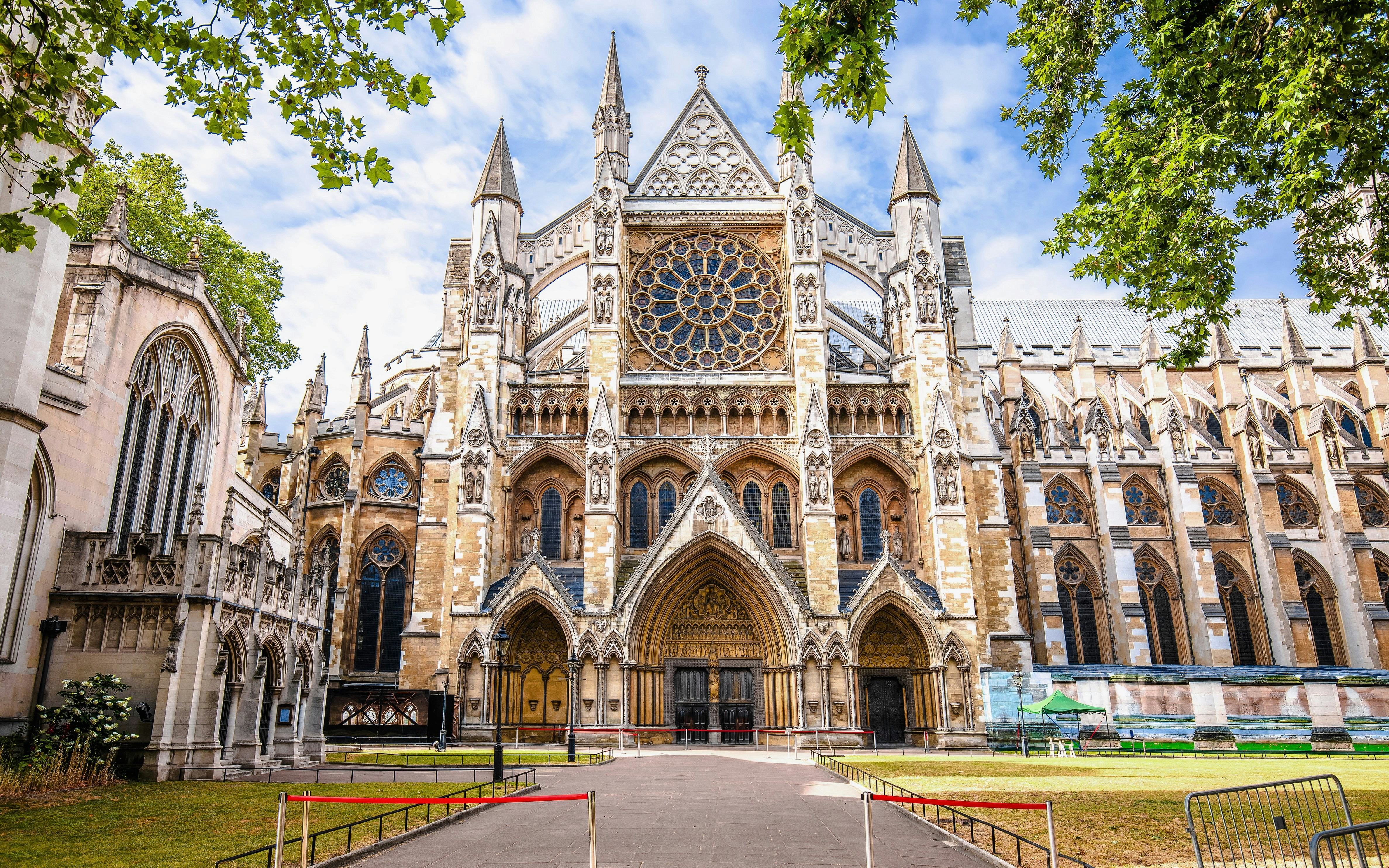 Westminster Abbey exterior with Gothic architecture and rose window in London.
