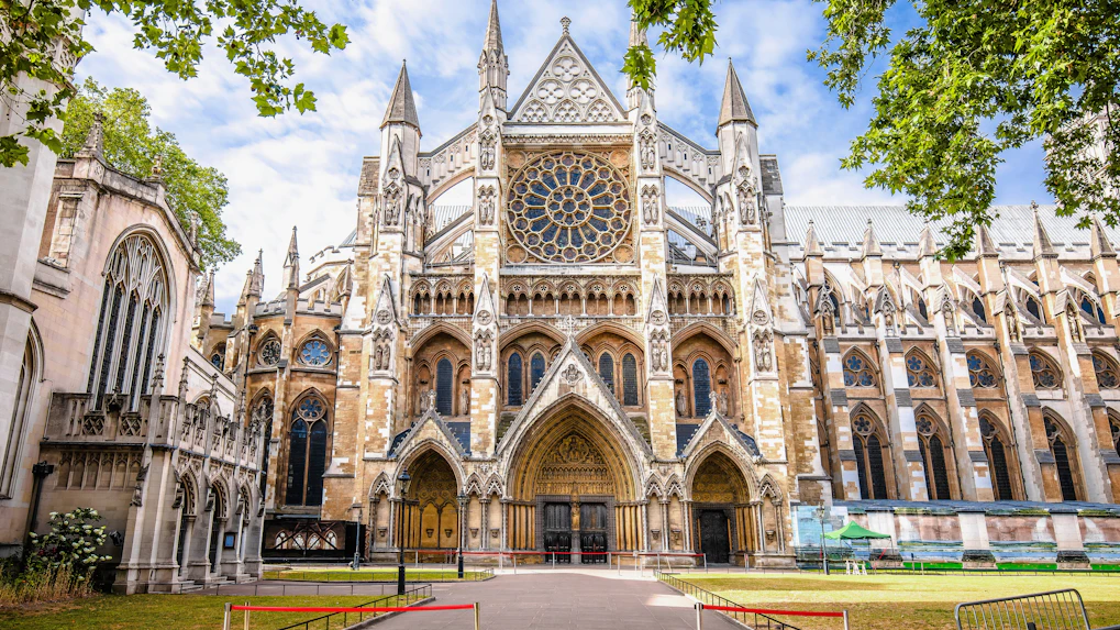 Westminster Abbey exterior with Gothic architecture and rose window in London.