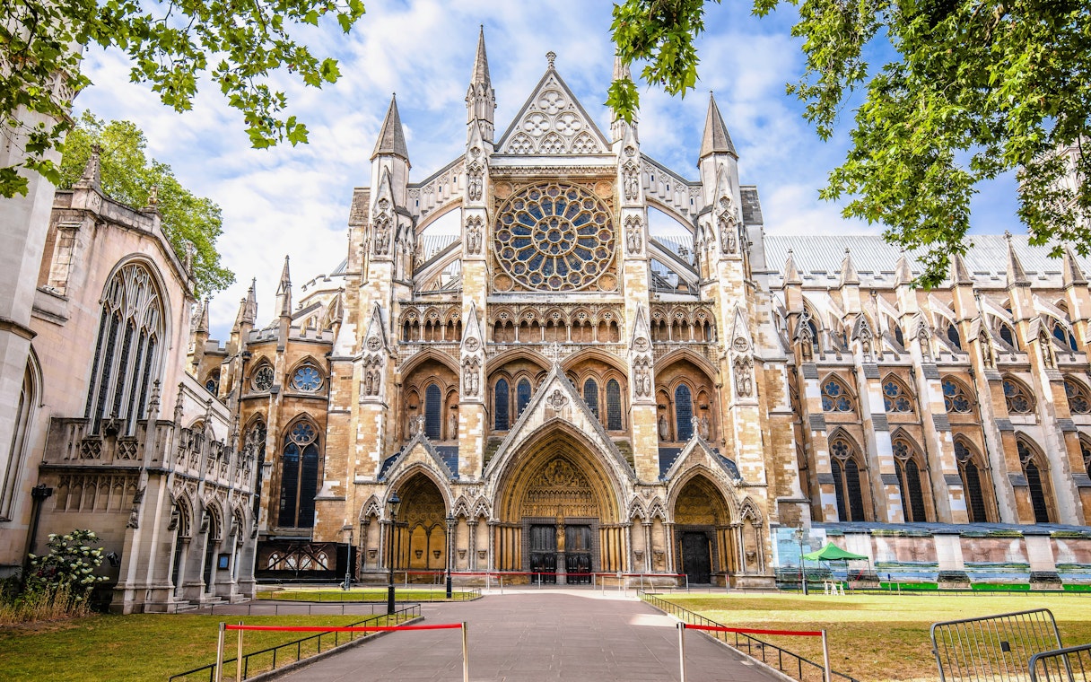 Westminster Abbey exterior with Gothic architecture and rose window in London.