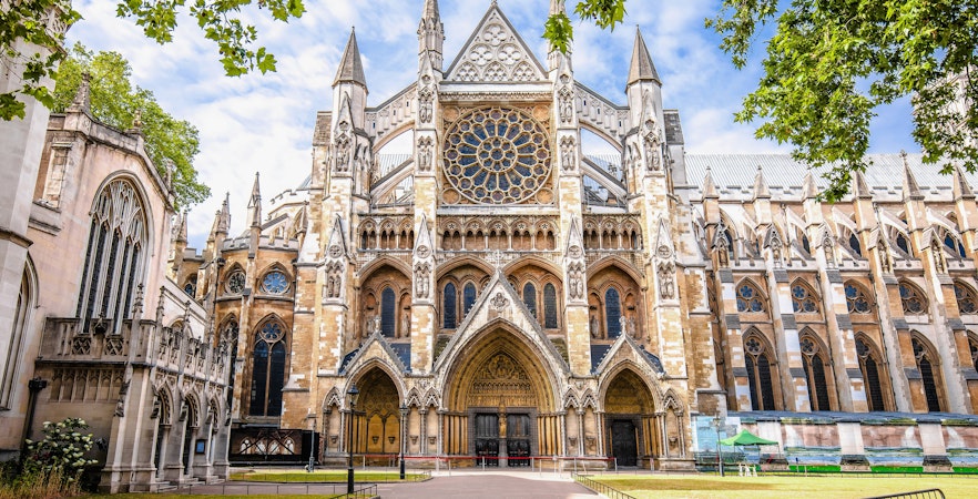 Westminster Abbey exterior with Gothic architecture and rose window in London.