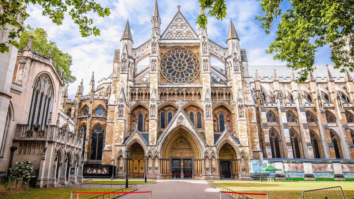 Westminster Abbey exterior with Gothic architecture and rose window in London.
