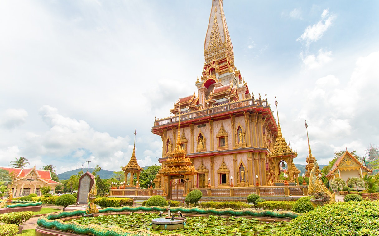 Wat Chalong temple with ornate architecture and dragon sculptures in Phuket, Thailand.