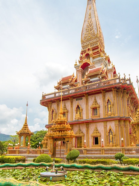 Wat Chalong temple with ornate architecture and dragon sculptures in Phuket, Thailand.