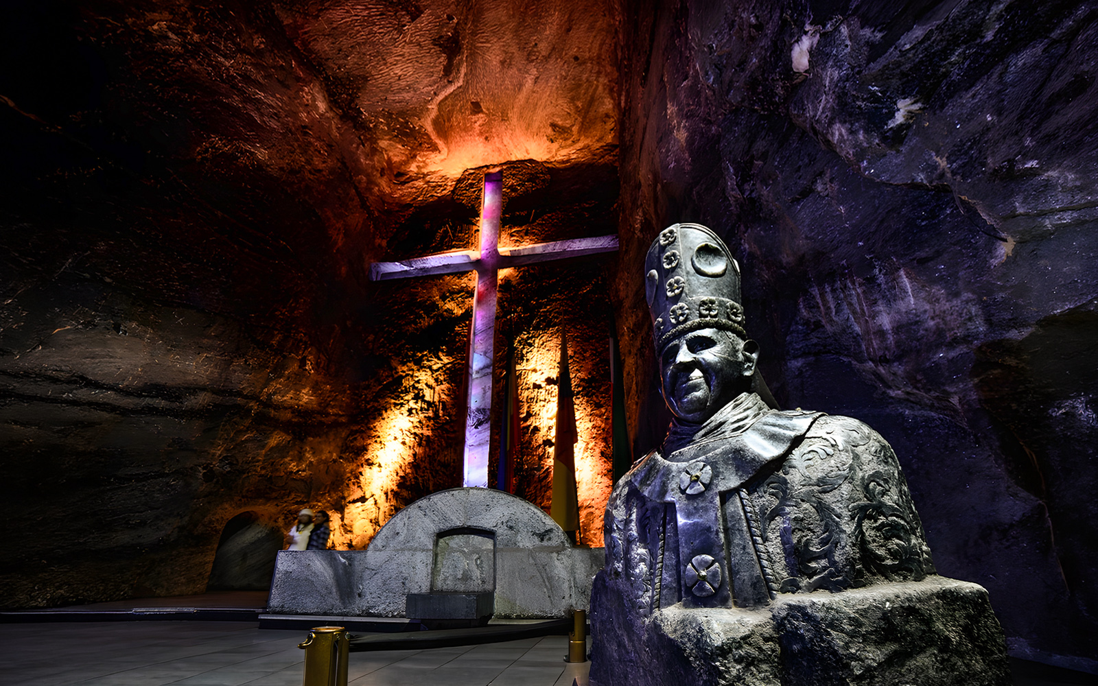 Statue and illuminated cross in the nave of Salt Cathedral of Zipaquirá, Colombia.
