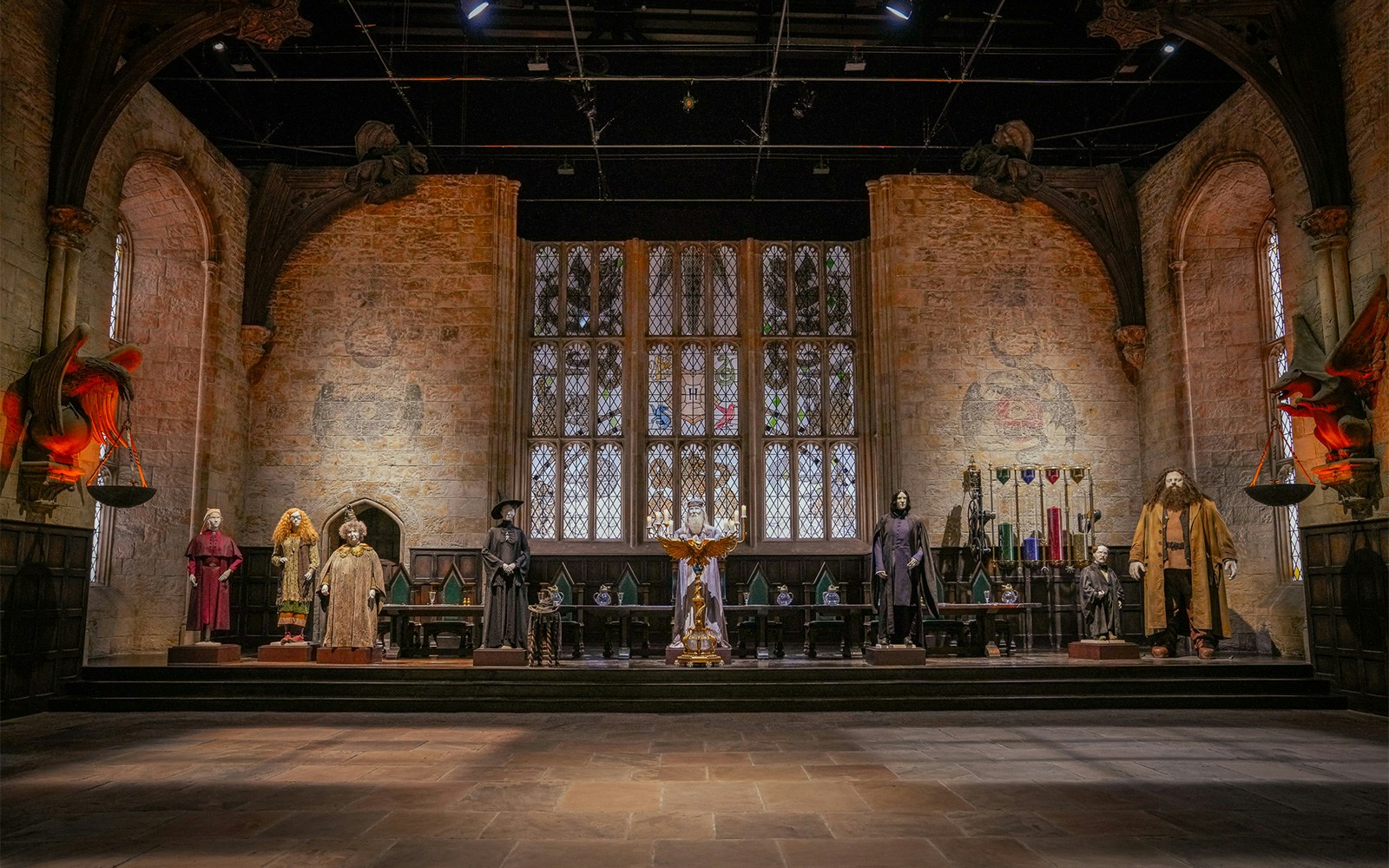 Costumes displayed in the Great Hall set from Harry Potter films.