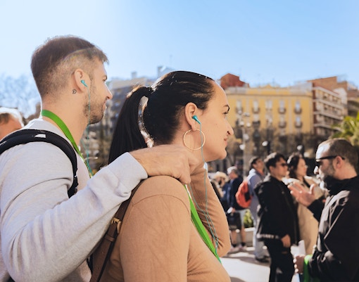 Tourists with audio guides on a fast track tour outside Sagrada Familia, Barcelona.