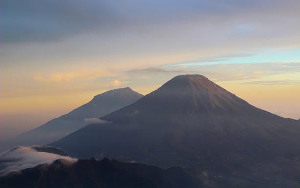 Dieng Plateau mountains at sunrise during a guided tour from Yogyakarta.