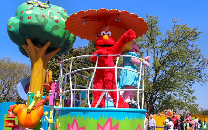Sesame Street characters on a parade float at Sesame Place Philadelphia.