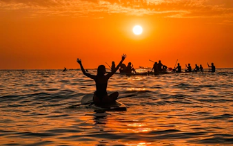 Stand-up paddleboarding at sunrise in Rio de Janeiro.