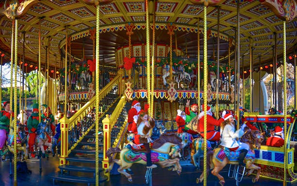 Carousel ride with festive decorations at Gardaland Park.
