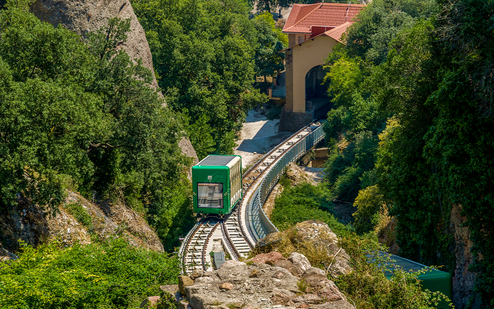 Santa Cova Funicular Railway descending through Montserrat rock formations, Spain.