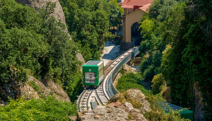 Santa Cova Funicular Railway descending through Montserrat rock formations, Spain.