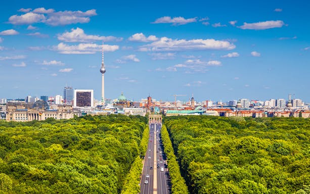Berlin skyline with TV Tower and Brandenburg Gate, view from Tiergarten.