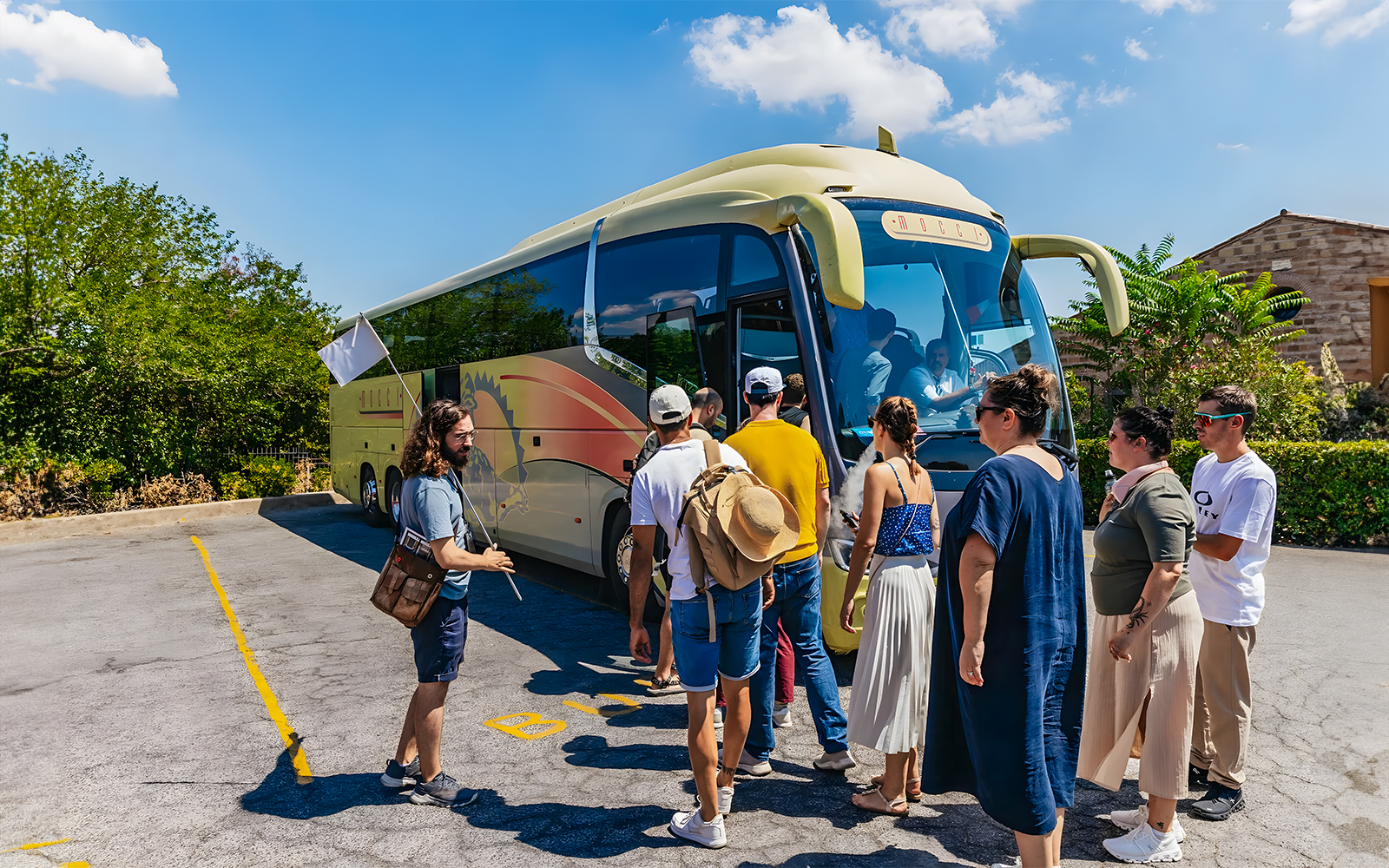 Tour group boarding bus for Roman Basilicas & Catacombs tour on Appian Way.