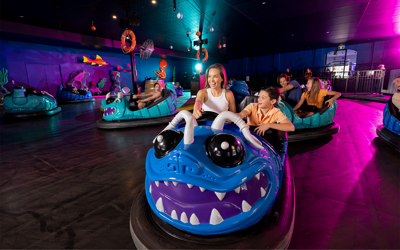 Bumper car ride at Dreamworld Gold Coast with colorful cars and excited riders.
