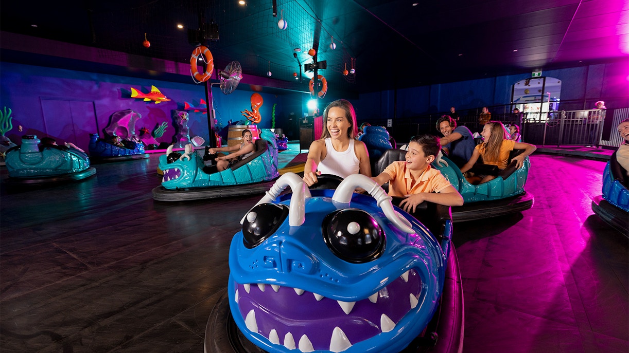 Bumper car ride at Dreamworld Gold Coast with colorful cars and excited riders.