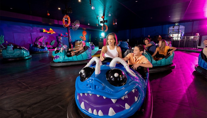 Bumper car ride at Dreamworld Gold Coast with colorful cars and excited riders.