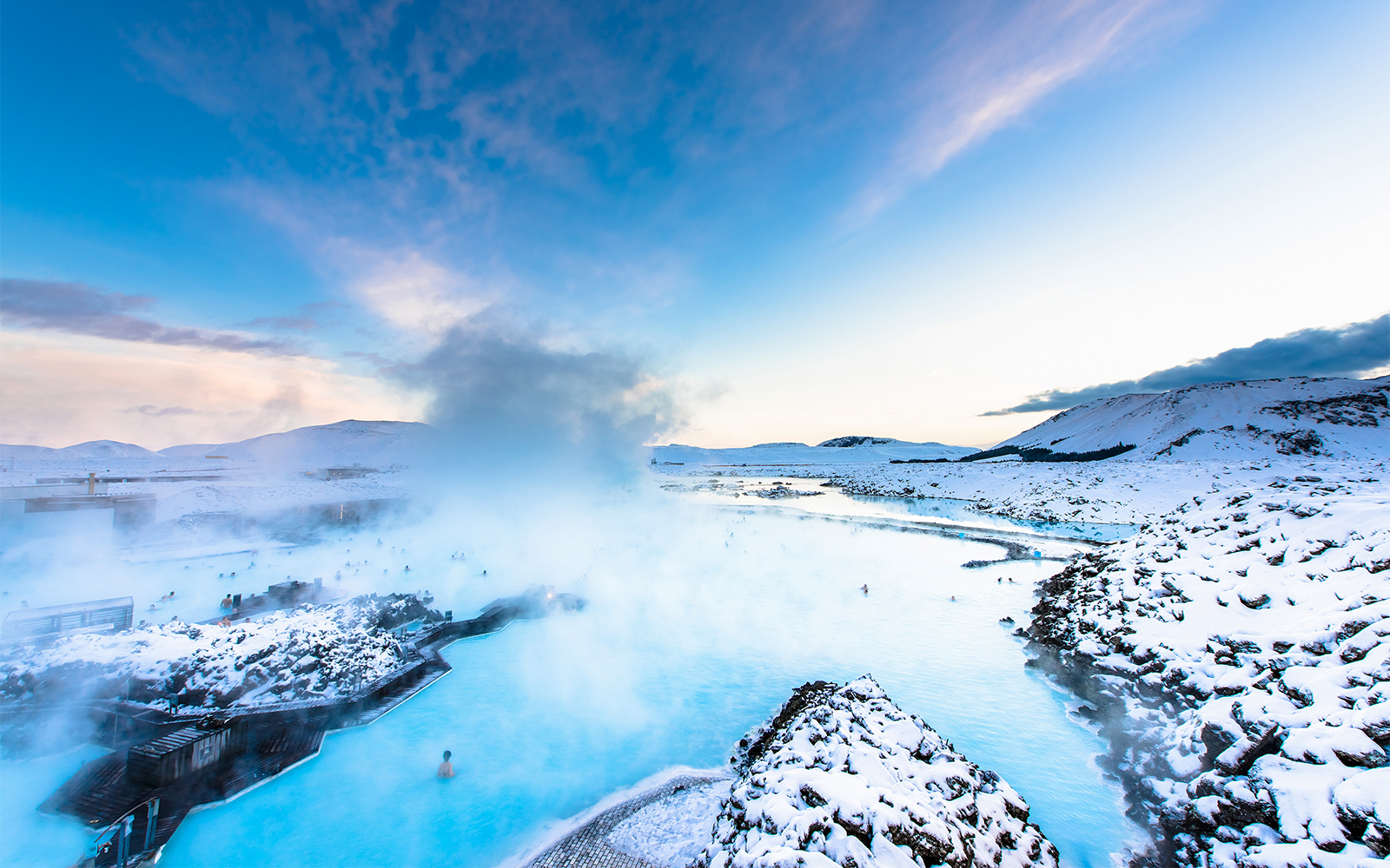 Blue Lagoon hot spring spa with visitors enjoying geothermal waters in Iceland.