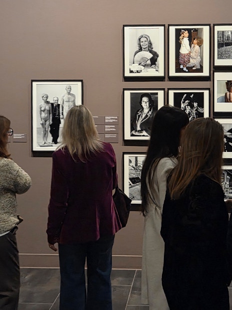 Tourists viewing black-and-white photographs at the Russian Museum exhibition.