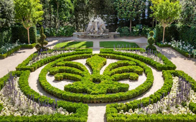 Formal garden with intricate hedges and fountain at Caumont Centre d’Art, Aix-en-Provence.