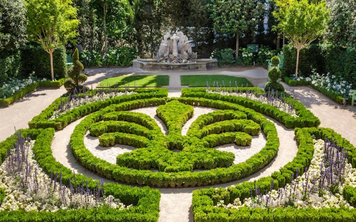 Formal garden with intricate hedges and fountain at Caumont Centre d’Art, Aix-en-Provence.