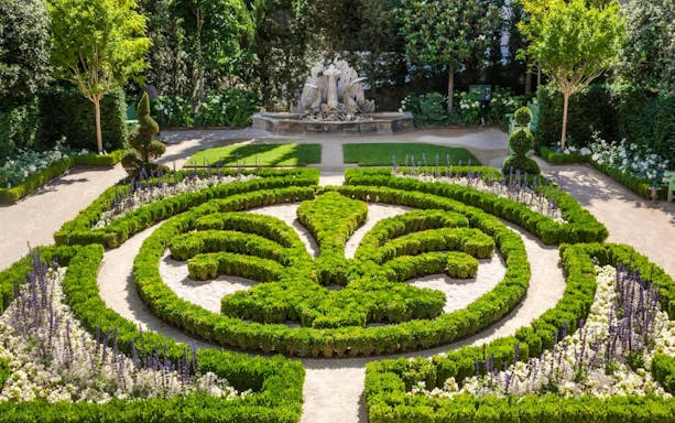 Formal garden with intricate hedges and fountain at Caumont Centre d’Art, Aix-en-Provence.