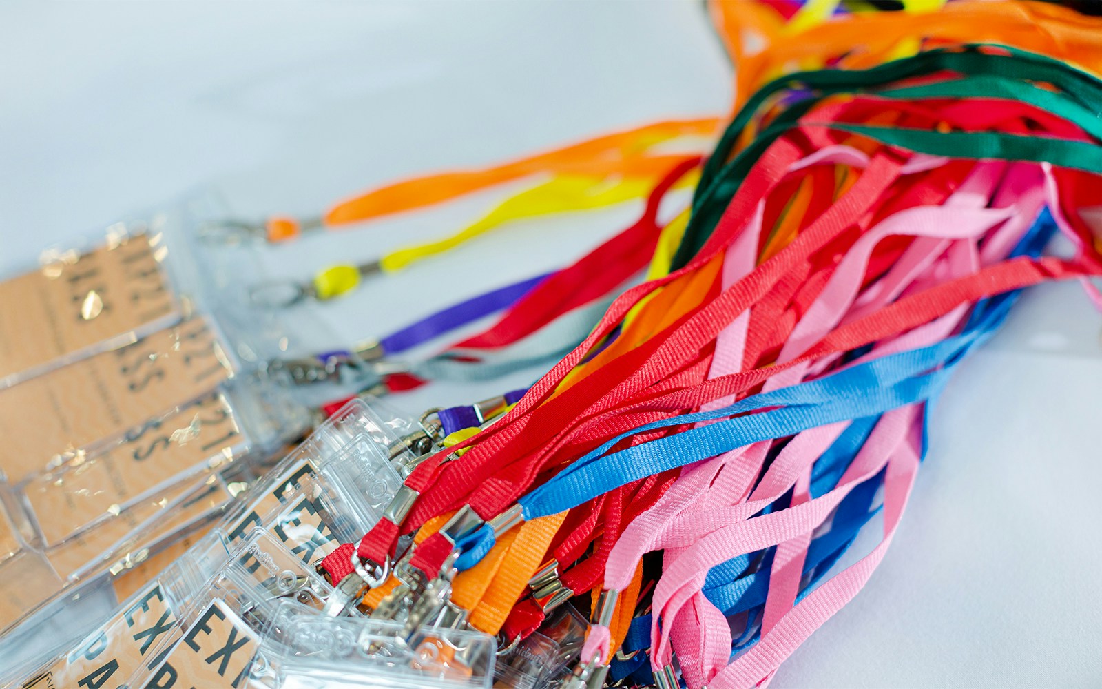 Colorful lanyards with attached badges for event access.