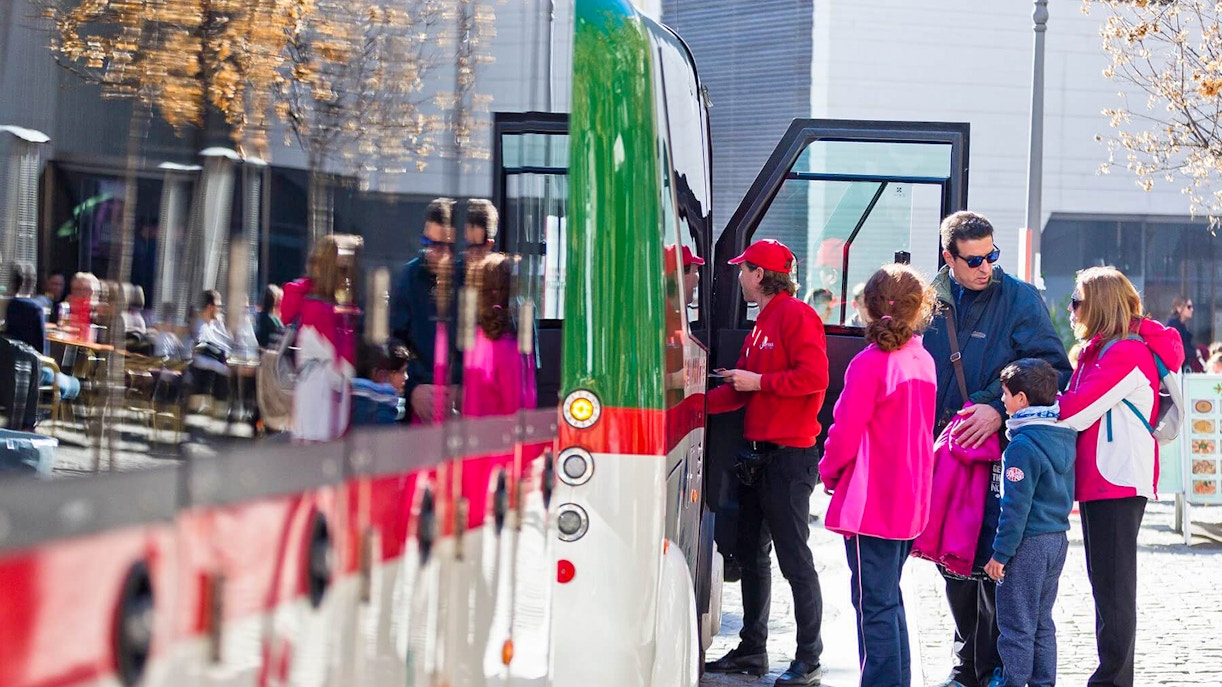 Tourists boarding a tour bus in Granada.