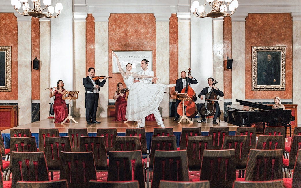 Vienna Residence Orchestra performing with dancers at Old Stock Exchange Palace.