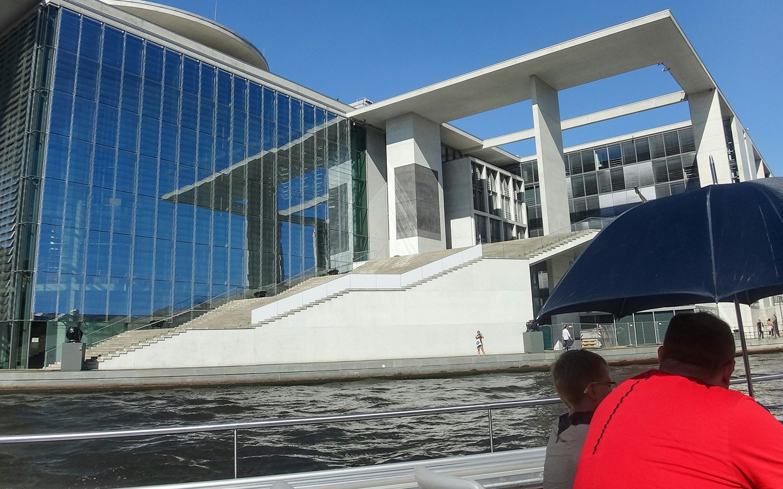 Berlin sightseeing cruise view of modern riverside building near Hackescher Markt.