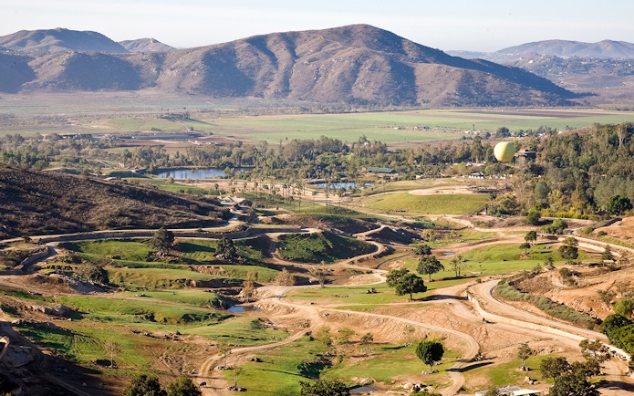 San Diego Zoo Safari Park landscape with Africa Tram paths and distant mountains.