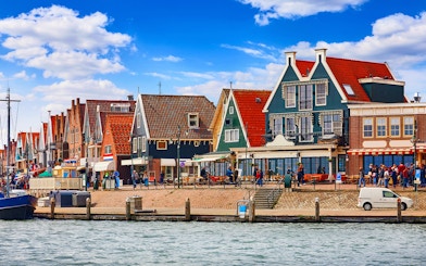Colorful Dutch houses along the waterfront in Volendam, Netherlands.