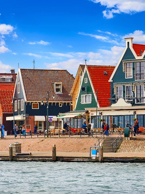 Colorful Dutch houses along the waterfront in Volendam, Netherlands.