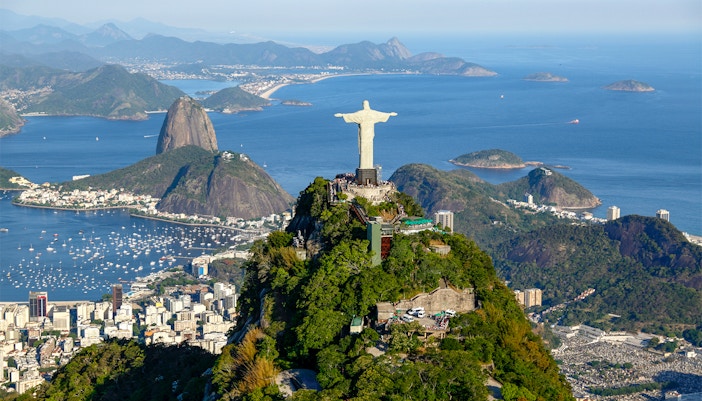 Christ the Redeemer overlooking Rio de Janeiro with Sugarloaf Mountain in the background.