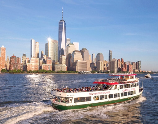 Circle Line cruise with view of New York City skyline and Empire State Building.