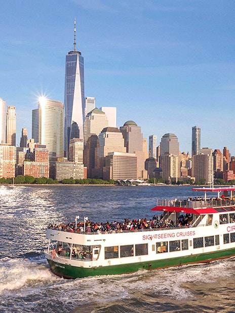 Circle Line cruise with view of New York City skyline and Empire State Building.